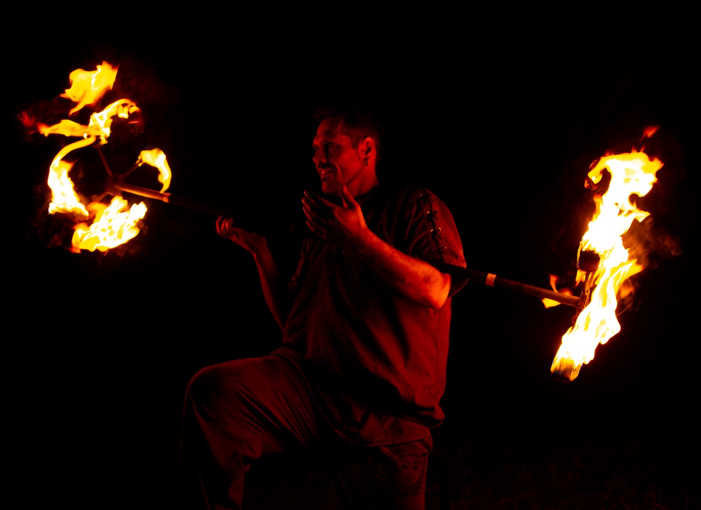 Fabiano Eccel in a dragonstaff fire performance, photographed by Tini Ruskia
